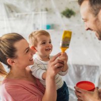 young family repainting their home - home decoration stock pictures, royalty-free photos & images