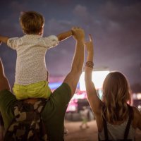 young family with son on street fair. - concert stock pictures, royalty-free photos & images