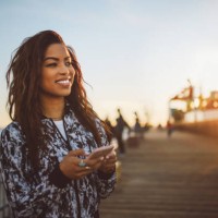 young fashionable woman texting on her phone in santa monica, la - fashion stock pictures, royalty-free photos & images