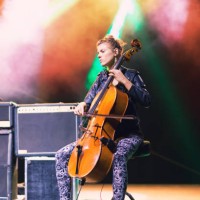 young female cellist playing on a stage at the concert - concert stock pictures, royalty-free photos & images