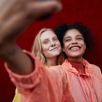 young female friends photographing outdoors - fashion stock pictures, royalty-free photos & images