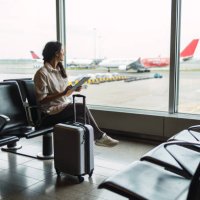 young female passenger waiting for flight at airport lounge - travel stock pictures, royalty-free photos & images