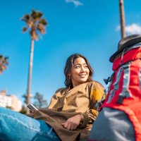young female traveller using smart phone while enjoying her vacation - travel stock pictures, royalty-free photos & images