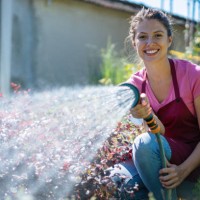 young florist working in the garden - garden decoration stock pictures, royalty-free photos & images