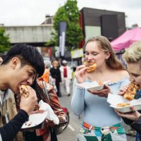 young friends enjoying east end street food for lunch - food stock pictures, royalty-free photos & images