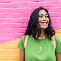 young generation z woman standing against brightly colored wall - fashion stock pictures, royalty-free photos & images