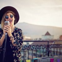 young girl is singing on the roof terrace party - concert stock pictures, royalty-free photos & images