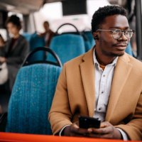 young handsome businessman in public bus - travel stock pictures, royalty-free photos & images