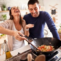 young happy attractive couple at home kitchen tasting - food stock pictures, royalty-free photos & images