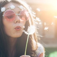 young hippie woman blowing dandelion outside - garden decoration stock pictures, royalty-free photos & images