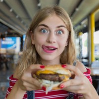 young hungry woman - junk food stock pictures, royalty-free photos & images