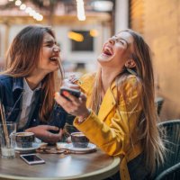 young ladies gossiping in cafe - coffee stock pictures, royalty-free photos & images