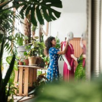 young latin woman putting dress in mannequin - fashion stock pictures, royalty-free photos & images