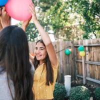 young latino women decorating at the backyard party - garden decoration stock pictures, royalty-free photos & images