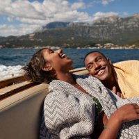 young man and woman laughing in speedboat - travel stock pictures, royalty-free photos & images