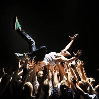 young man beeing carried by group of people - concert stock pictures, royalty-free photos & images