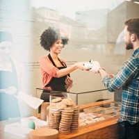 young man buying food snack bar - junk food stock pictures, royalty-free photos & images
