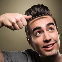 young man combing his quiff - hairstyle stock pictures, royalty-free photos & images
