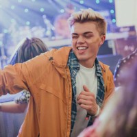 young man dancing at a music festival - concert stock pictures, royalty-free photos & images