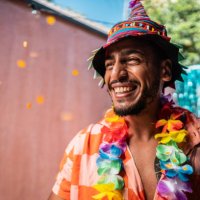 young man enjoying carnival at home - garden decoration stock pictures, royalty-free photos & images