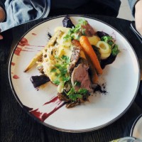 young man enjoying freshly served traditional icelandic food with fork and knife in a restaurant - food stock pictures, royalty-free photos & images
