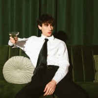 young man having a champagne - fashion stock pictures, royalty-free photos & images