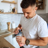 young man making protein shake before training - food stock pictures, royalty-free photos & images