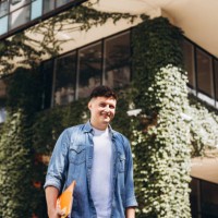 young man near building with living walls. - garden decoration stock pictures, royalty-free photos & images