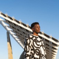 young man portrait looking horizon against blue sky at sunset - fashion stock pictures, royalty-free photos & images
