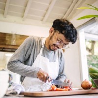 young man preparing to cook - food stock pictures, royalty-free photos & images