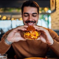 young man ready to eat a burger - food stock pictures, royalty-free photos & images