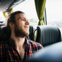 young man relaxing during a bus trip - travel stock pictures, royalty-free photos & images