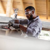 young man renovating the attic - home decoration stock pictures, royalty-free photos & images