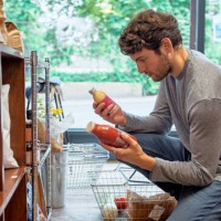 young man shopping in food store. - food stock pictures, royalty-free photos & images