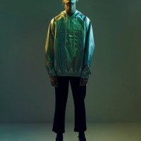 young man standing in coloured lights with closed eyes , shot on studio - fashion stock pictures, royalty-free photos & images