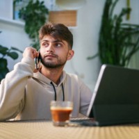 young man using digital tablet at the coffee shop - junk food stock pictures, royalty-free photos & images