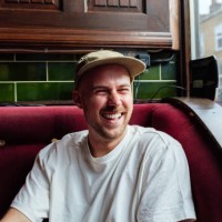 young man with cap relaxing in an establishment - fashion stock pictures, royalty-free photos & images