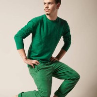 young man with moustache in green clothes - fashion stock pictures, royalty-free photos & images