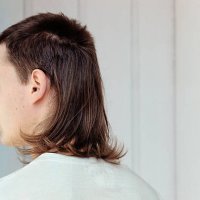 young man with mullet - hairstyle stock-fotos und bilder