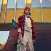 young modern woman outdoors in the city, with skateboard. - fashion stock pictures, royalty-free photos & images