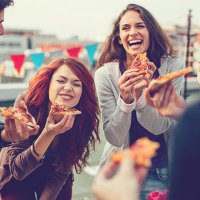 young people eating pizza at party - junk food stock pictures, royalty-free photos & images