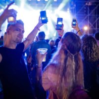 young people on music festival holding smart phones and filming - concert stock pictures, royalty-free photos & images