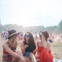 young people sitting on blanket at music festival - concert stock pictures, royalty-free photos & images