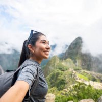 young peruvian woman taking a selfie in sacred city of machu picchu, peru - travel stock pictures, royalty-free photos & images