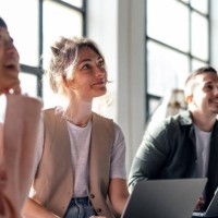 young professionals collaborating in modern co-working space - fashion stock pictures, royalty-free photos & images