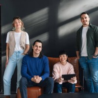 young professionals in a modern co-working space together - fashion stock pictures, royalty-free photos & images