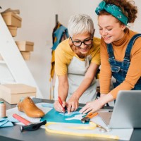 young shoemaker learning to work from the older colleague - fashion stock pictures, royalty-free photos & images