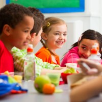 young students enjoying their lunch at school - food stock pictures, royalty-free photos & images