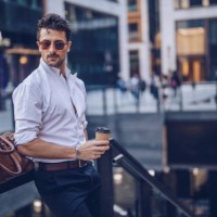 young stylish businessman having takeaway coffee - fashion stock pictures, royalty-free photos & images