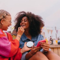 young stylish girl zoomers doing make-up outdoors. - fashion stock pictures, royalty-free photos & images